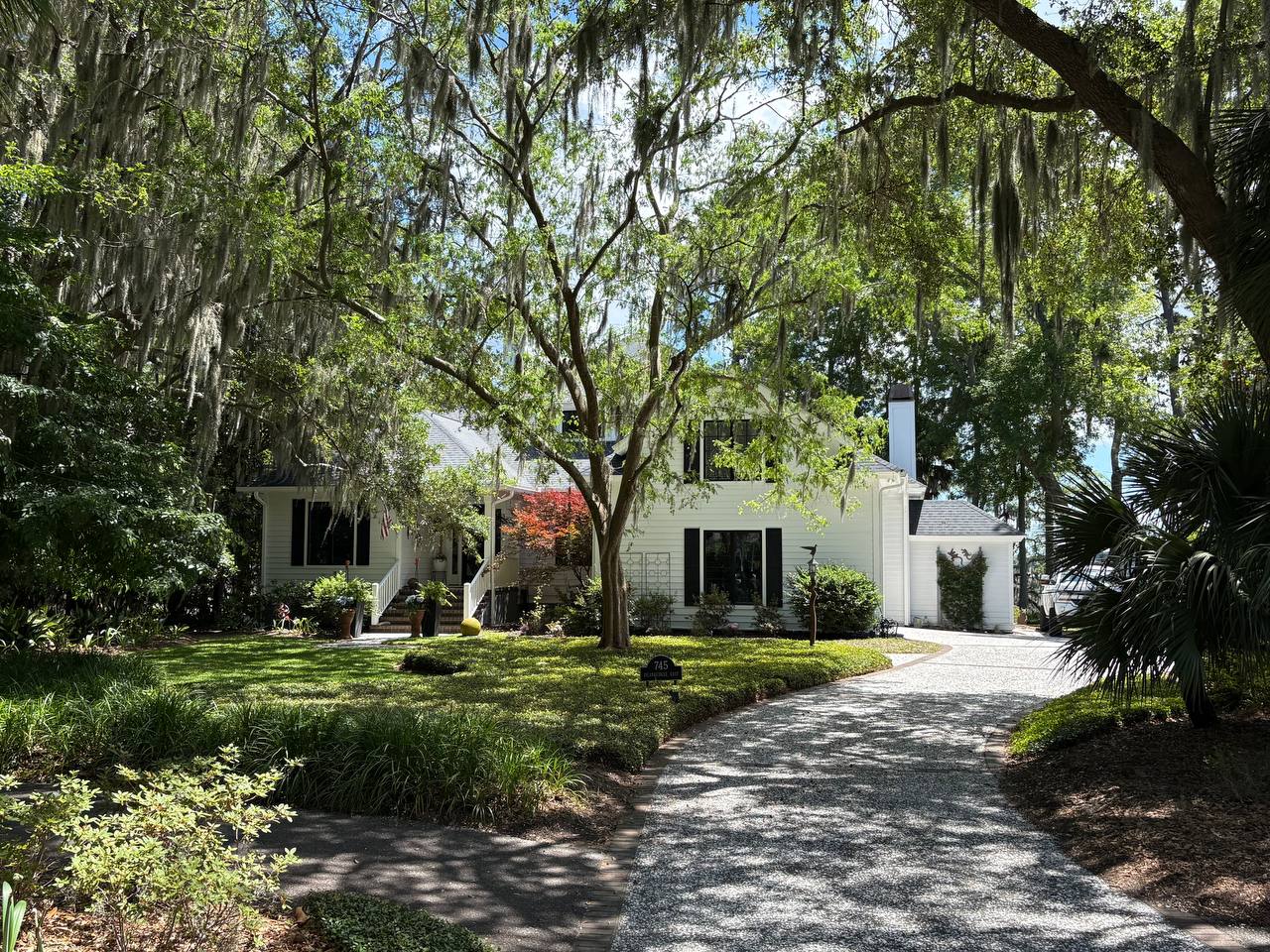 Lush Lowcountry garden estate with hydrangeas and palmetto trees